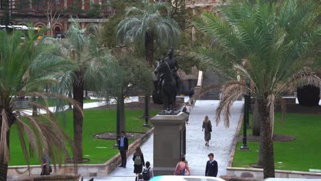 Static-shot-at-Anzac-square-capturing-off-work-office-workers-walking-towards-central-railway-station,-underground-subway-at-downtown-Brisbane-city,-central-business-district