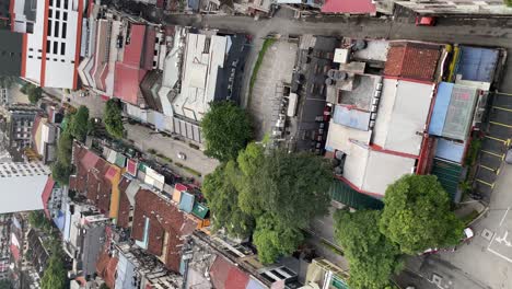 Vertical-Video---Top-view-of-shops,-houses-and-streets-in-Changkat-Bukit-Bintang,-Kuala-Lumpur,-Malaysia