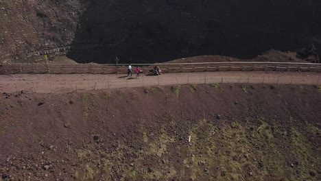 Tourists-on-top-of-mount-Vesuvius-volcano-with-slow-reveal-of-the-mountain