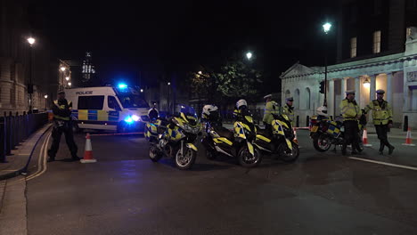 UK-November-2018---A-unit-of-Metropolitan-police-officers-guard-a-security-cordon-during-the-investigation-of-a-suspect-package-near-Downing-Street-on-Whitehall-in-London