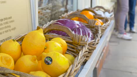 Organic-Fruit-and-Vegetable-Baskets-Outside-High-Street-Grocery-Store