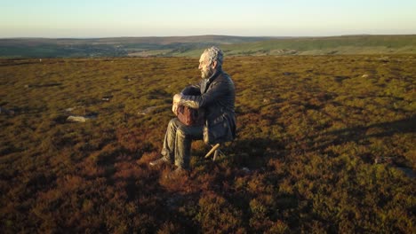 "The-Seated-Man"-by-Sean-Henry-is-a-bronze-sculpture-placed-on-an-elevated-site-on-the-North-York-Moors-in-2017