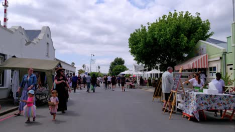 Timelapse-of-people-moving-around-a-street-during-a-market-day