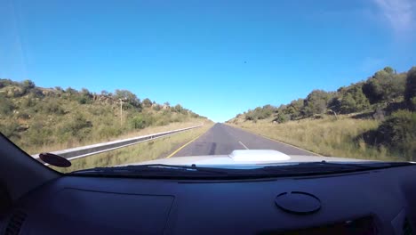 Time-lapse-of-driving-vehicle-at-passengers-side-with-a-view-of-summer-green-fields