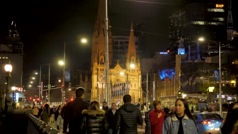 people-walking-on-Princess-Bridge-in-melbourne-nighttime-duting-winter-season