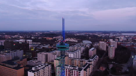 Aerial-drone-view-of-Elisa-communication-tower-in-Pasila,-Helsinki-Finland