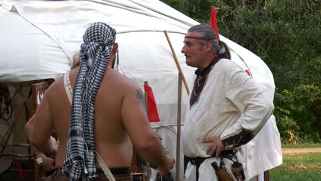 Savaria-carnival,-Medieval-camp-closer-shot-man-huging-and-kissing-medieval-woman