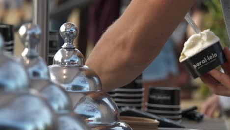 Close-Up-of-Hands-of-Seller-in-Icecream-Shop-in-Parque-de-la-Ciutadella,-Barcelona,-Spain