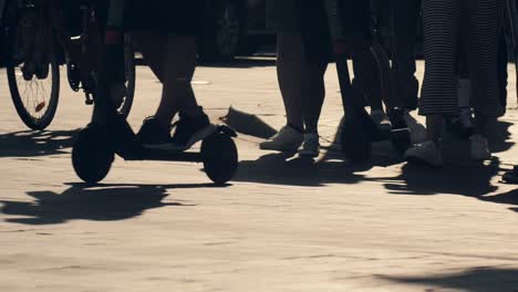 Crowd-pedestrian-crossing-city-street-intersection-at-evening