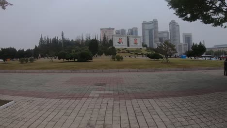 Pedestrians-walking-along-sidewalk-of-Somun-Street