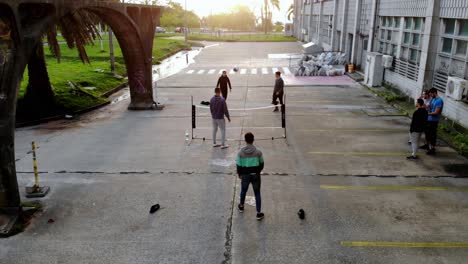 Aerial-video-of-group-of-friends-playing-soccer-tennis-with-a-net