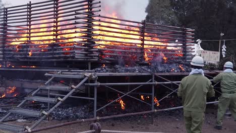 Slow-motion-static-shot-as-ritual-fire-starts-on-morning-of-annual-mountain-burning-event-in-Japan