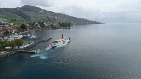 drone-footage-of-swiss-near-Leman-Lake,-showing-grape-fields,-boats,-harbor,-small-towns