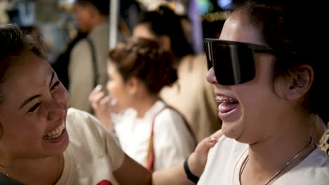 young-woman-trying-on-sunglasses-laughing