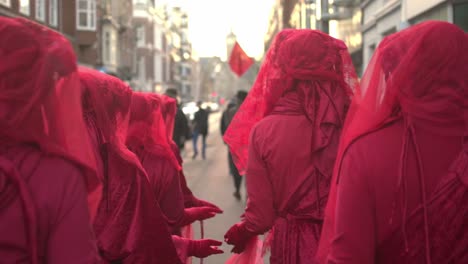 Extinction-Rebellion-Red-Brigade-Walking-Down-Street