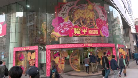 Shoppers-walk-past-a-shopping-mall-with-Chinese-Lunar-New-Year-theme-decoration-during-the-preparations-for-the-upcoming-Chinese-lunar-new-year-Ox-holidays