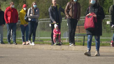 Close-up-view-of-people-slowly-moving-in-the-line-to-get-their-vaccine-from-covid-19