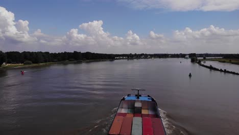 Aerial-Above-As-Alexandra-Cargo-Ship-Travels-Along-Oude-Maas