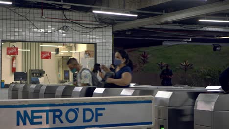 Passengers-enter-the-ticket-gate-turnstile-at-the-metro-station