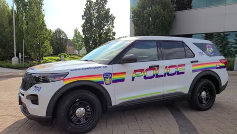 Side-View-Of-Police-Car-Parked-In-Front-Of-A-Building-In-Mississauga,-Canada---close-up