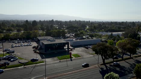 Tesla-Dealership-and-Service-Center,-Drone-view-rotating-360-around-the-facility