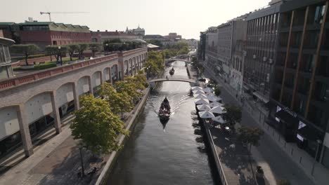 Romantic-boat-cruise-on-Moliceiros,-canals-of-Ria-de-Aveiro,-Portugal