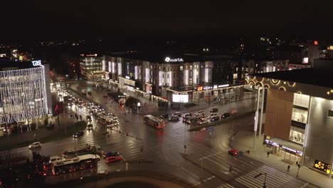 Drone-shot-of-Tartus-city-centre-traffic-on-backround-Tasku,-kaubamaja-and-Kvartal-Vspa