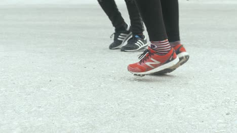 Runners-warming-up-on-their-feet-before-marathon