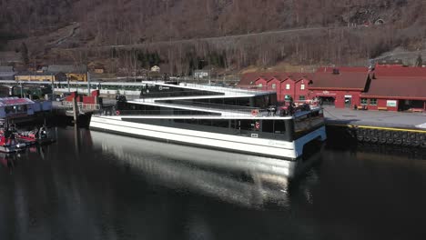 Electric-high-speed-craft-named-Future-of-the-fjords-alongside-in-Flam-Norway---Seaside-aerial-showing-details-of-unique-design-and-vessel