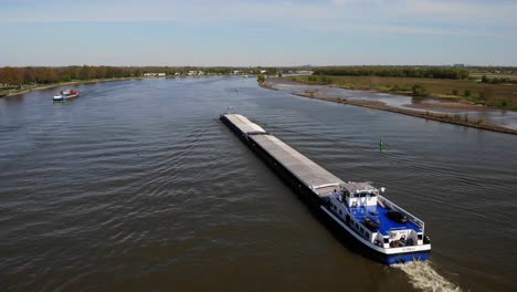 Aerial-View-Along-Port-Side-Of-Sivali-Inland-Push-Tow-Ship-Travelling-Along-Oude-Maas