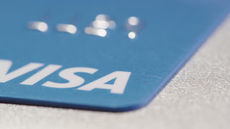 TRACKING-SHOT-across-VISA-written-on-a-credit-card