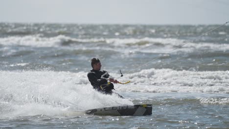 Kitesurfer-riding-the-waves-on-the-Sonderstrand-on-Romo-island