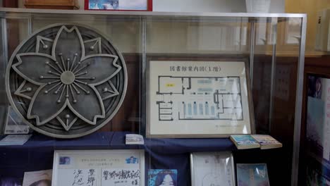 Toyosato-Elementary-School-Museum-History-Display-with-Sakura-Crest