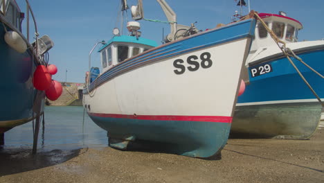 Fishing-Boats-In-Dry-Dock-On-A-Sunny-Day-In-Newquay-Harbour,-Cornwall,-England,-UK