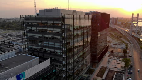 Office-buildings-and-Ciurel-bridge,-aerial-sunset-scene,-Bucharest-Romania