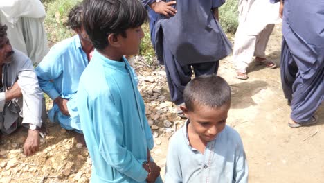 Pair-Of-Young-Boys-At-Roadside-During-Flood-Relief-Aid-In-Balochistan