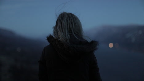 A-girl-gazes-out-at-a-gorge-from-a-scenic-viewpoint