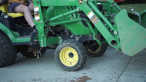 SLOWMO---New-Zealand-woman-driving-John-Deere-small-tractor