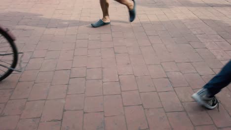 People-walking-crowd-feet-in-busy-public-street