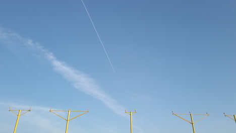 Off-Centre-Tilting-Down-Shot-Revealing-Approach-Lighting-System-at-Leeds-Bradford-International-Airport-in-Yorkshire,-England-on-Sunny-Morning