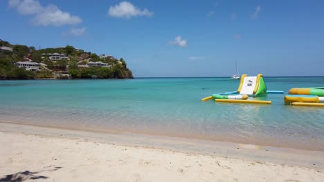 Waves-crashing-along-the-shoreline-with-beach-resorts-in-the-background