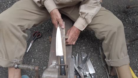 A-stabilized-clip-of-a-Vietnamese-man-with-a-prosthetic-leg-with-a-mobile-knife-sharpening-business