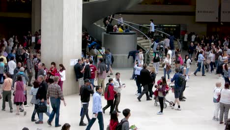 Medium-shot-over-the-atrium-zone-inside-the-Louvre-Museum,-Paris,-France