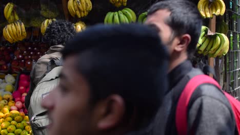 An-Indian-woman-purchasing-fruits-from-the-seller-from-the-street-stalls-of-Darjeeling