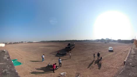 the-construction-field,-Workers-build-an-industrial-doom,-worker-build-a-concert-stage,-stage-equipment,-timelapse-of-Hugh-contraction-on-site-collection,-sky,-clouds-timelapse