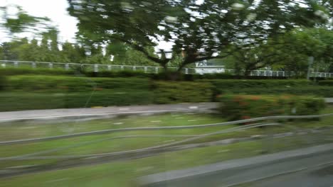 View-from-the-back-seat-of-a-tourist-taxi-in-heavy-traffic-in-Bangkok,-Thailand