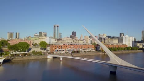 Aerial-shot-flying-towards-Puente-de-la-Mujer,-a-famous-location-in-Puerto-Madero-area