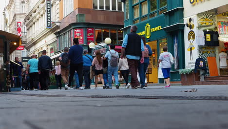 People-walking-in-street-of-city-center-of-Budapest-Hungary