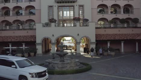 Cinematic-Pull-Back-Aerial-of-Entrance-to-Luxury-Sheraton-Grand-Hacienda-Cabo-Hotel-in-Los-Cabos,-Mexico