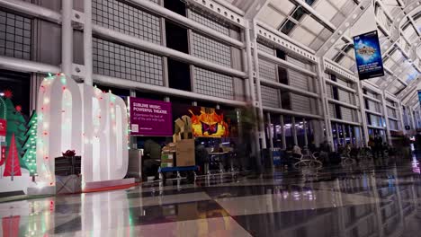 Slow-zoom-out-time-lapse-of-a-busy-airport-terminal-at-O'Hare-International-airport-on-Dec-26th